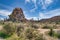 Huge rock mountain and lush Joshua trees at Joshua Tree National Park desert