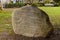 A huge rock with a poem inscribed on it on the back lawn of the Vancouver City Hall by Ina Trudge on March 2000