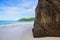 Huge rock on Seychelles sand beach day