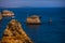 Huge rocks at the cliff beach Praia da Marinha, lovely hidden beach near Lagoa, Algarve Portugal