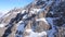 Huge rocks covered with snow. Ledges from the snowy mountains.