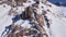 Huge rocks covered with snow. Ledges from the snowy mountains.