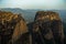 Huge rocks at sunrise with Meteora valley in background near Kalambaka, Thessaly