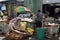 Huge sacks of recyclable materials being stacked and sorted by workers in the city junk yard shop