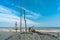 Huge sandcastle with stones and sticks at the beach