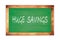 HUGE  SAVINGS text written on green school board