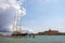 huge ship with sails near the pier of the Venetian canal in Venice, about vacations