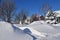 Huge snowdrifts in front of  houses