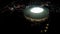 Huge sports arena shining with lights in heart of night megalopolis, aerial shot