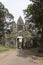 Huge statues of Khmer king adorn the north gate of Angkor Thom.