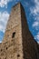 A huge stone tower in San gimignano, Tuscany, shot with wide angle lens