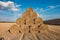 Huge straw pile of Hay roll bales on among harvested field. cattle bedding