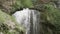 Huge stream of water falling down in honey waterfalls complex