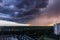 Huge thundercloud on the outskirts of the city before the rain - image