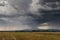 Huge thundercloud over a wheat field