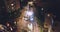 Huge truck loaded or unloaded excavator tractor in a residential district at night. Aerial view of heavy machinery scene