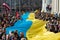 Huge Ukrainian flag in Vilnius, carried by people with Lithuanian and Ukrainian flags