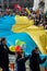 Huge Ukrainian flag in Vilnius, carried by people with Lithuanian and Ukrainian flags