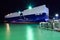 A huge vehicles carrier ship at the docks, photographed at night