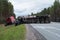 A huge wagon rolled over after an accident on the highway Scandinavia