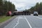 A huge wagon rolled over after an accident on the highway Scandinavia
