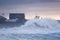 Huge waves crash over the seafront at Porthcawl, South Wales