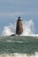 Huge Waves Surround Stone Lighthouse Tower in Maine