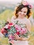 Huge wedding bouquet of colourful exotic flowers in the hands of the bride.