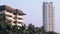 Huge white and brown modern hotel buildings under blue sky