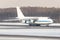 Huge white wide-body cargo airplane taxing on runway for take off at sunny winter day. Transportation, cargo, aviation