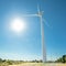 Huge wind generator against shining sun and blue sky. Oreites wind farm, Cyprus