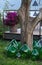 Huge wine bottles for storing wine at the winery garden. Set of different wine bottles in the garden of a picturesque vineyard