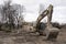 Huge yellow shovel digger on demolition site