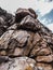 Huge yellow strange stone near sea. Alien planet landscape, rock formations. Dramatic toned photo for unusual, mistick