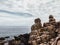 Huge yellow strange stone and sea. Alien planet landscape, rock formations. Dramatic toned photo for unusual, mistick