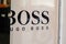 Hugo Boss store and text sign of German brand of luxury fashion house shop