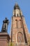 Hugo de Groot Monument dating from 1886 and Nieuwe Kerk clock tower in Delft