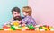 Hugs Are Fully Returnable. building home with color constructor. small boy with dad playing together. child development