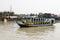 Hularhat, Bangladesh, February 27 2017: A colorful ship cruises the harbor