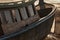 Hull and deckhouse of a wooden boat lying on the shore due to low tide, close-up