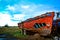 Hull of a Red Wrecked Boat