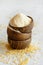 Hulled millet flour in wooden bowls and grain