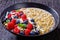 Hulled whole grain oat porridge with berries