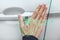 Human Chipping Concept, RFID Tags. A Female hand with an implantable chip opens the door of a car