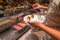 Human choosing delicious nigiri sushi in Japanese buffet counter