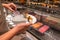 Human choosing fresh and delicious nigiri in sushi buffet counter