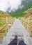 Human feet on climbing stairchase, nature landscape