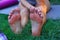 human feet after standing on yoga nail desk sadhu closeup photo on green grass background