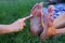 human feet after standing on yoga nail desk sadhu closeup photo on green grass background
