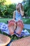 human feet after standing on yoga nail desk sadhu closeup photo on green grass background